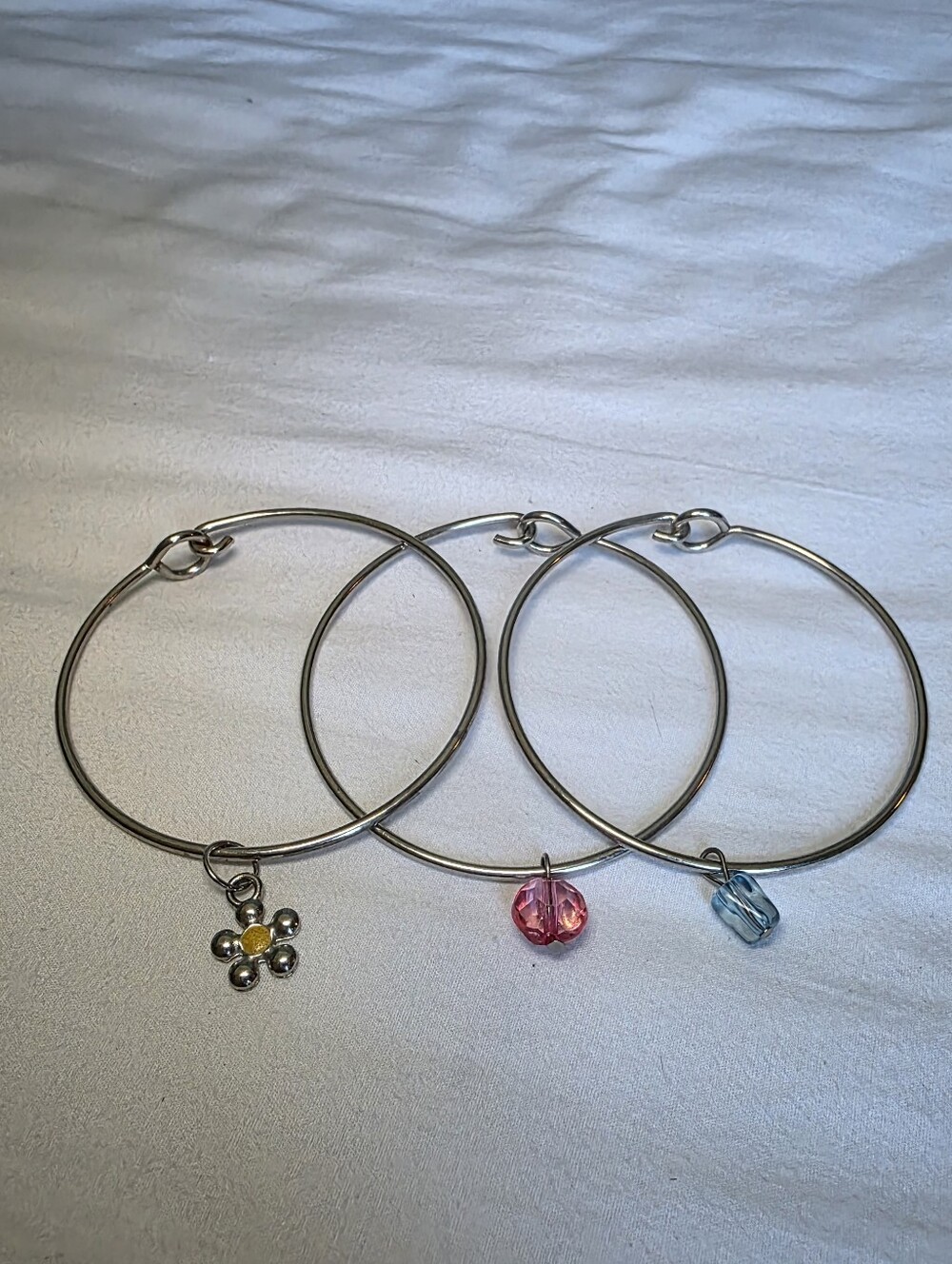 Silver Tone Triple Bangle Bracelet Set with Pink, Yellow & Blue Charms